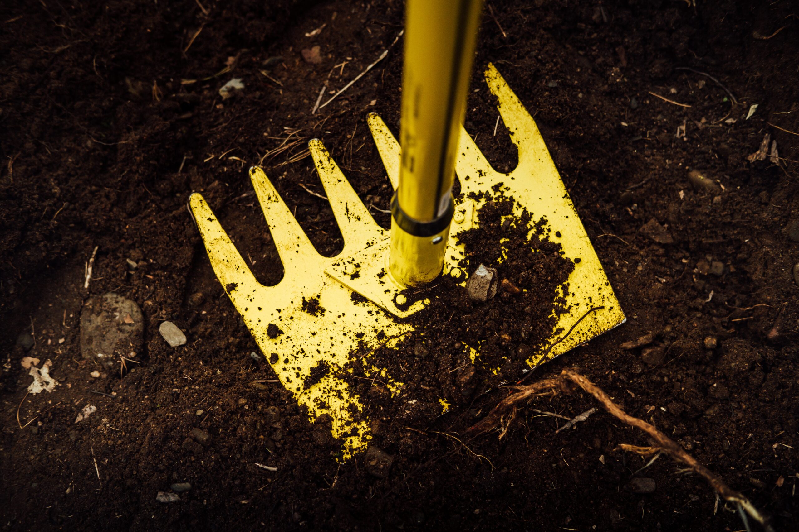 Rake in Soil | Plant Health Care Soil Amemdments by Burkholder PHC